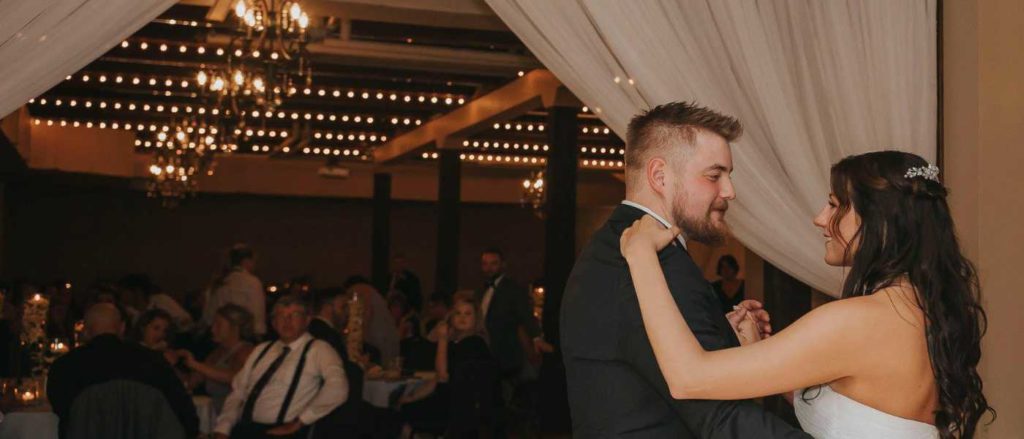 Couple dancing at ballroom reception